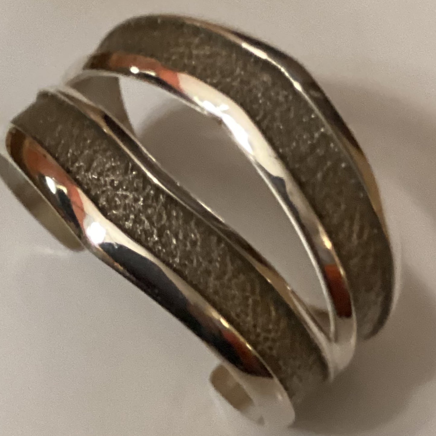 Bracelet, all silver, split racetrack design, tufa cast, Bennie Bowakaty crafted from Sterling Silver, an exquisite Bracelets Native America designed by Turquoise Mustang.
