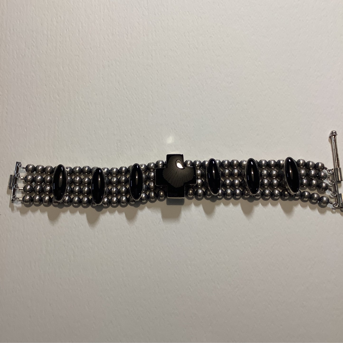 Bracelet, Navajo Pearl, 4-strand, Onyx Cross with Ovals, DD crafted from Sterling Silver, an exquisite DD Bracelets designed by Turquoise Mustang.