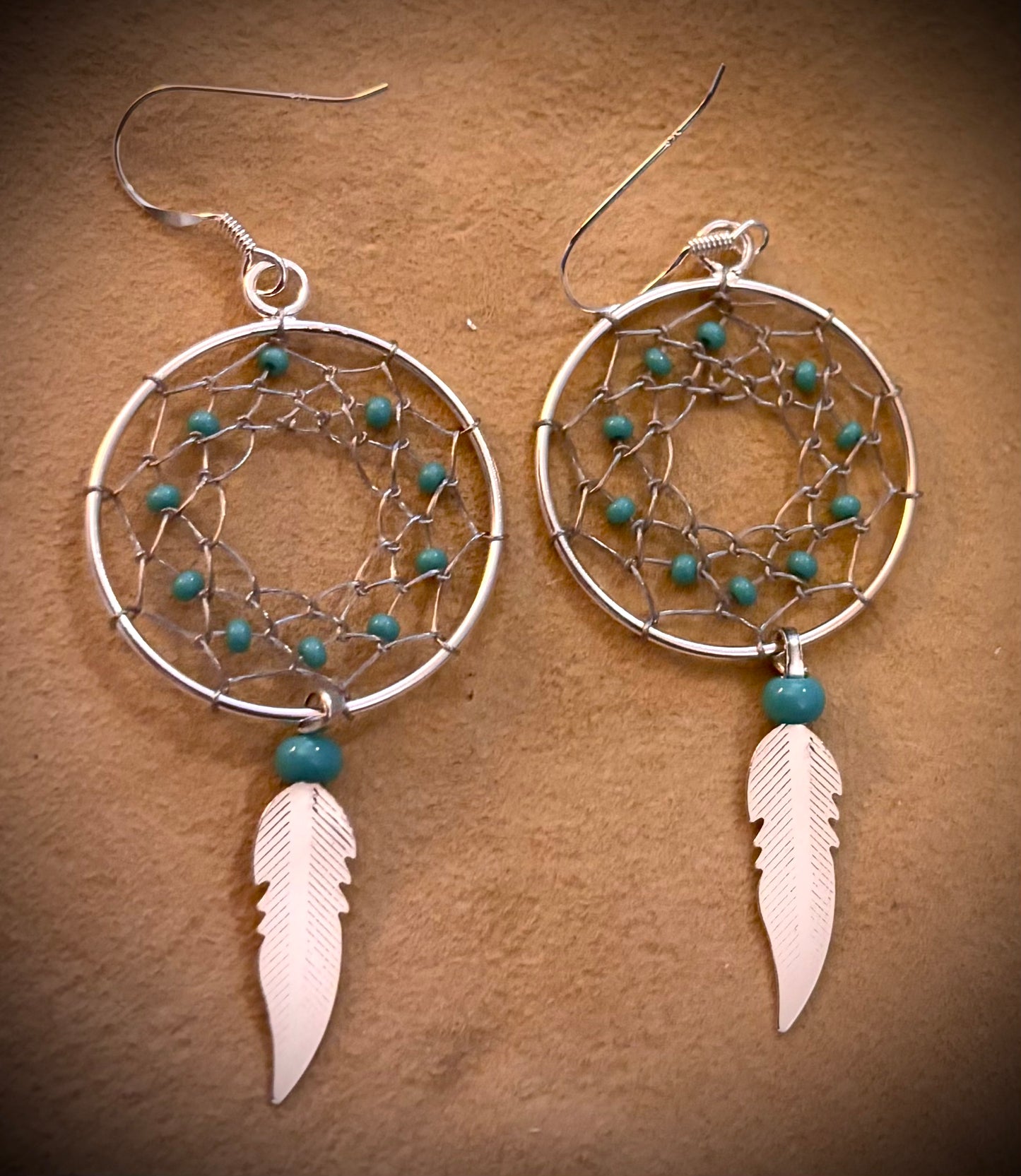 Earring, Dreamcatcher w/ 10 turquoise beads & feather dangle,