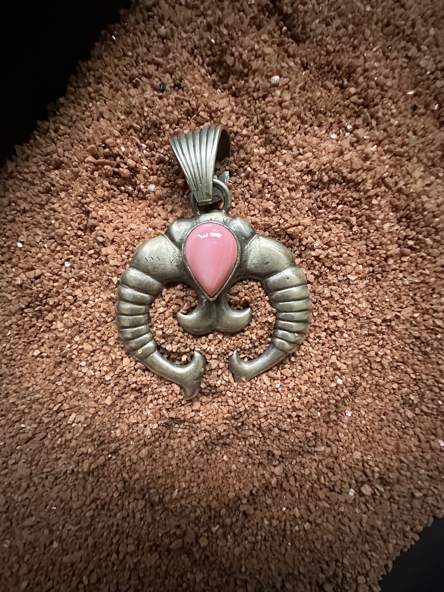 Ram’s Horn Naja with Pink Conch, by Sam Etsitty