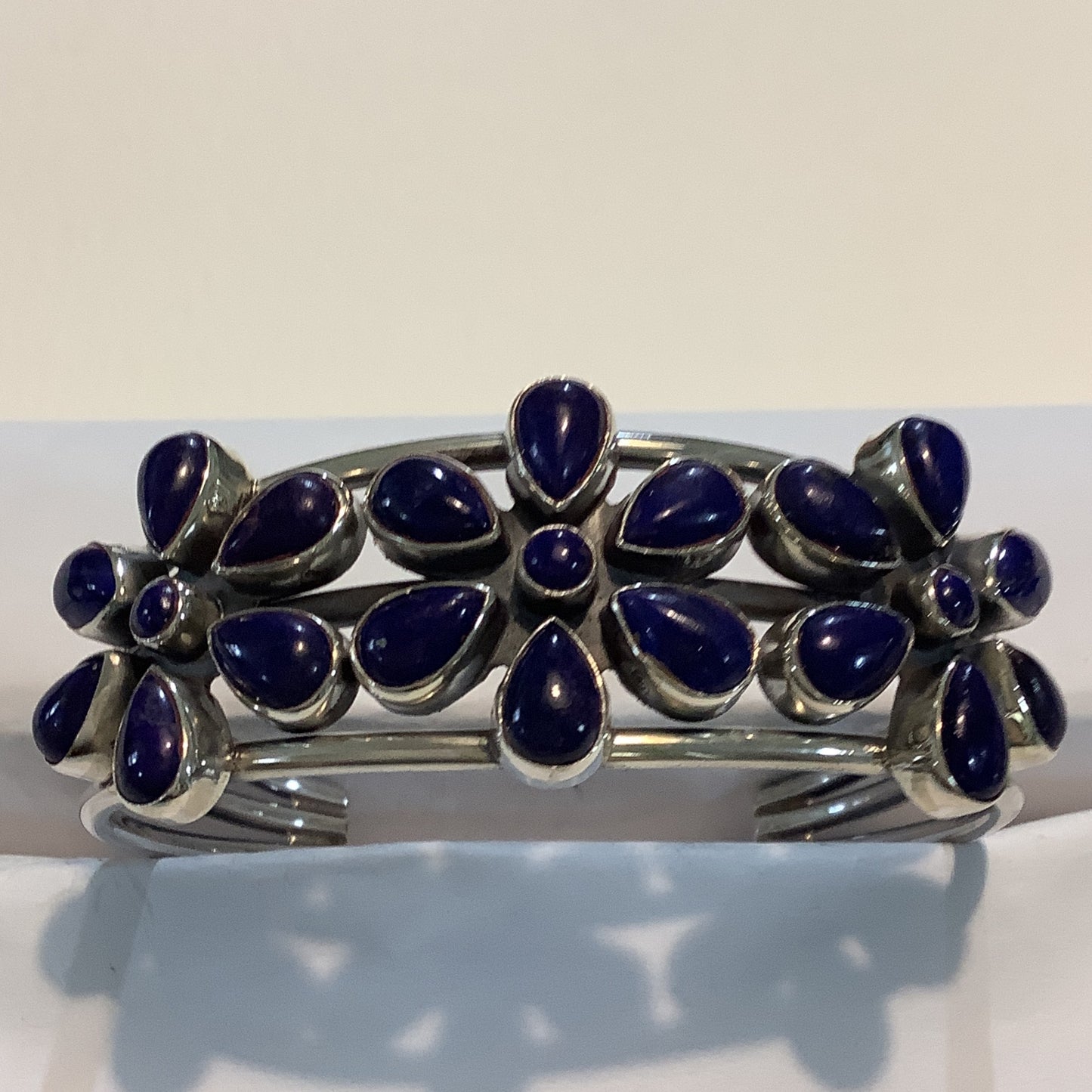 Bracelet, Wide, 3 "Daisy", 21 Lapis cabs, DD (1) crafted from Sterling Silver, an exquisite DD Bracelets designed by Turquoise Mustang.
