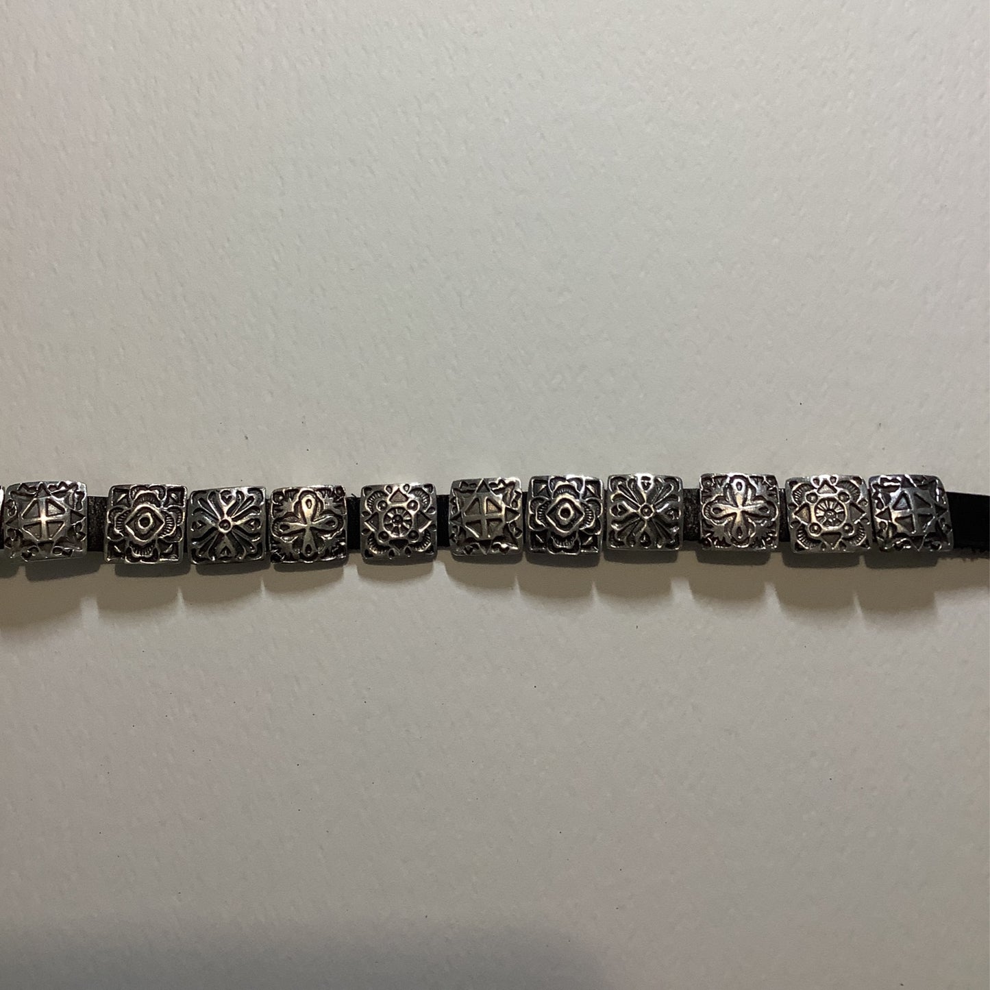 Bracelet, Leather w/ 12-15 small square conchos, DD crafted from Sterling Silver, an exquisite DD Bracelets designed by Turquoise Mustang.