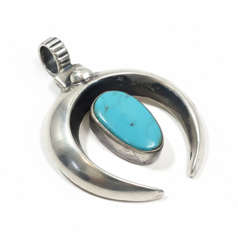 Pendant, Naja, Medium heavy cast w/ oval turquoise center stone, DD - Turquoise Mustang