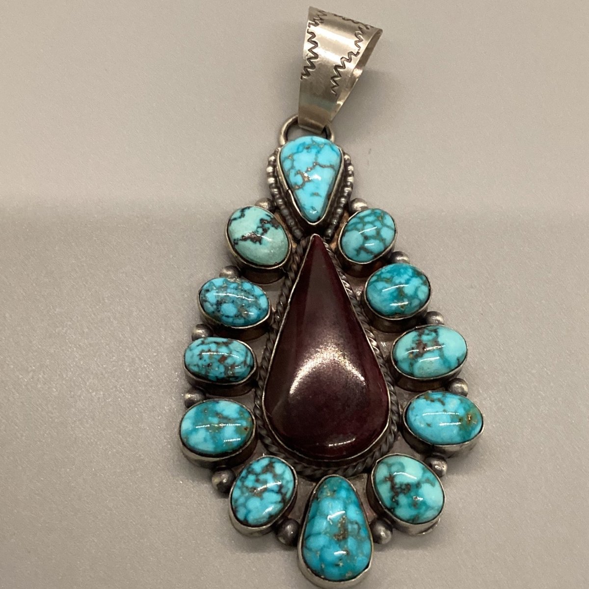 Pendant, 13 stone Purple Spiny Oyster Teardrop with Kman Birdsye bezel, Peterson Johnson - Turquoise Mustang