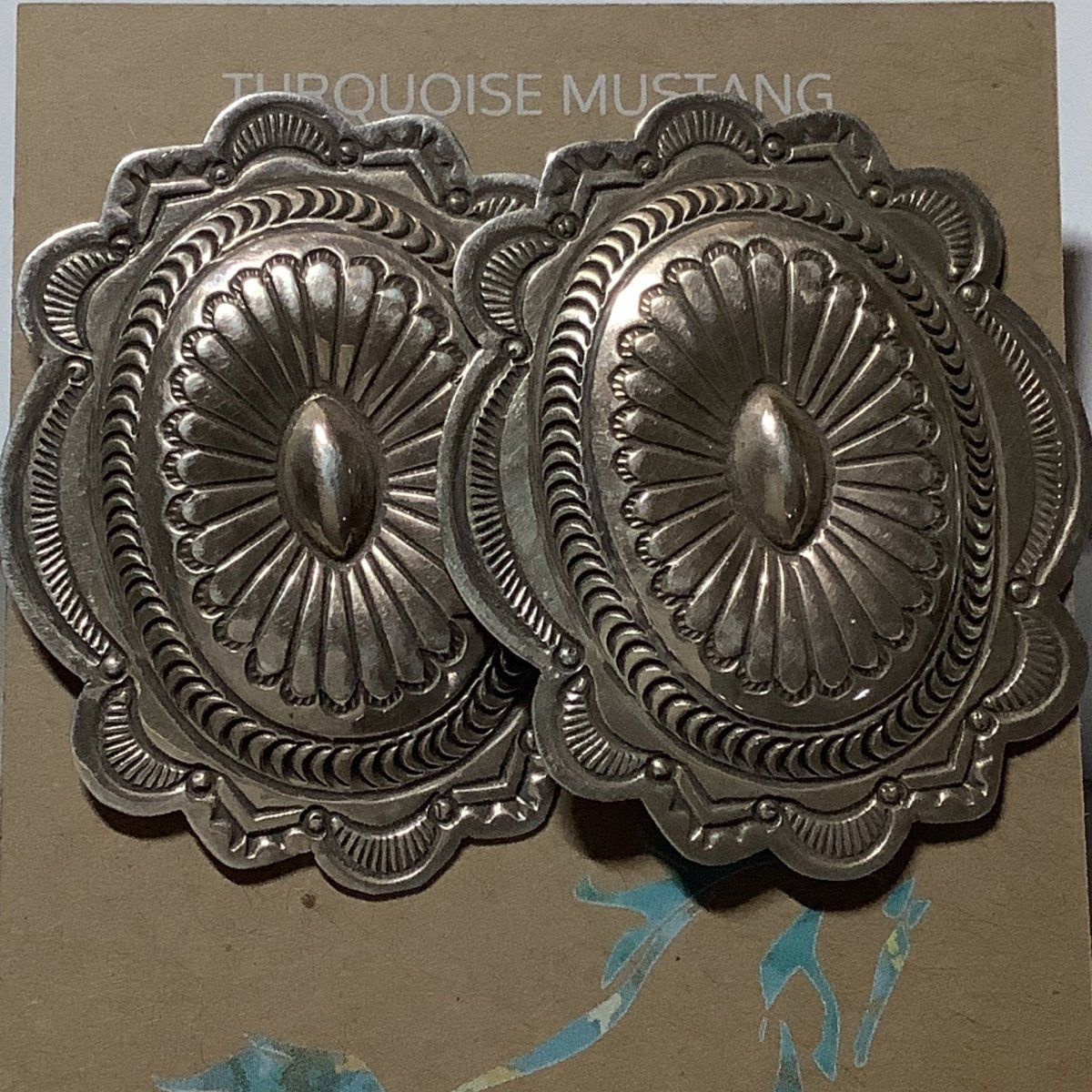 Earring, all silver, large single repoussee & stamp concho, Carson Blackgoat - Turquoise Mustang