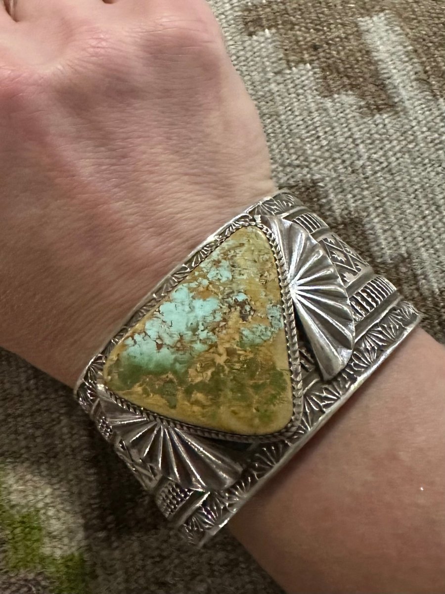 Bracelet, stamped wide cuff with triangular Royston cab, Adrian Reeves Long - Turquoise Mustang