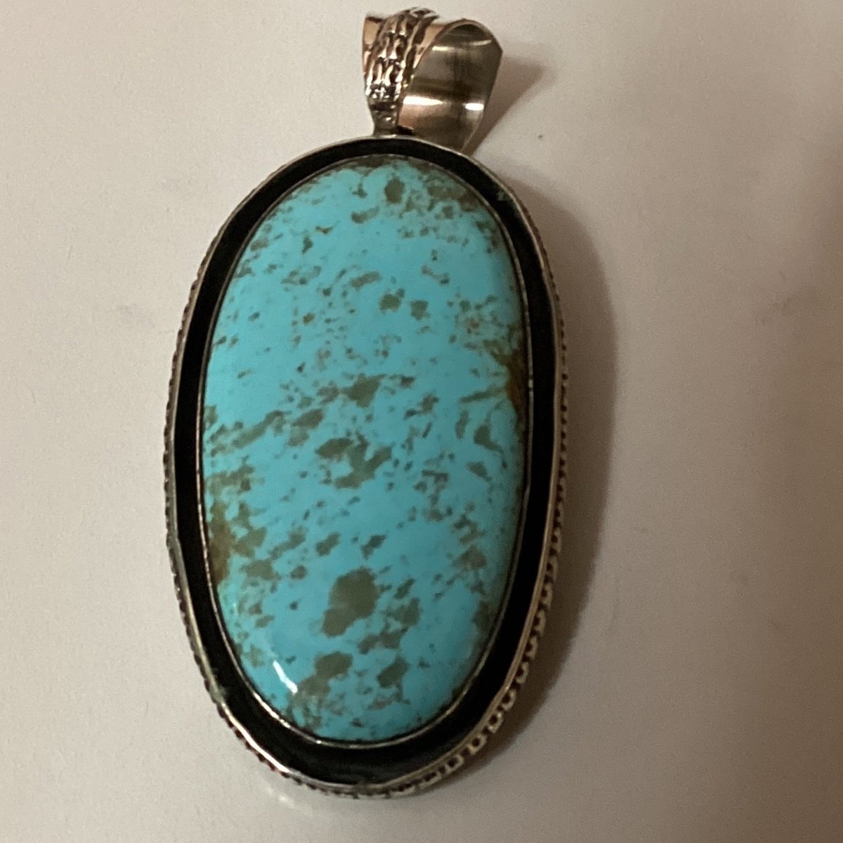 Pendant, large oval turquoise, shadow box bezel, Chimney Butte - Turquoise Mustang