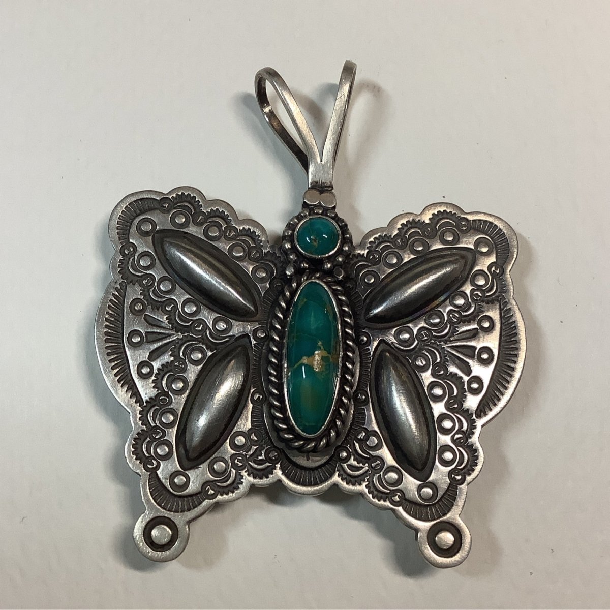 Pendant, Repousse Butterfly with Oval Royston Cab, HS hallmark - Turquoise Mustang