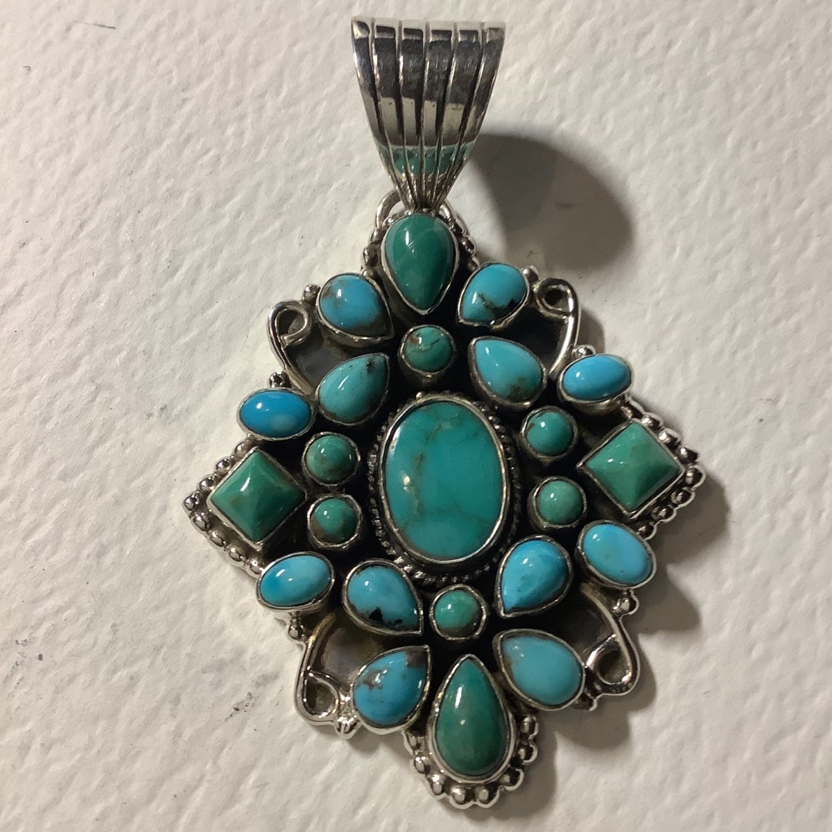 Pendant, Turquoise, Small Oval Cluster with 26 Turquoise cabs, raindrop Bezel, DD - Turquoise Mustang