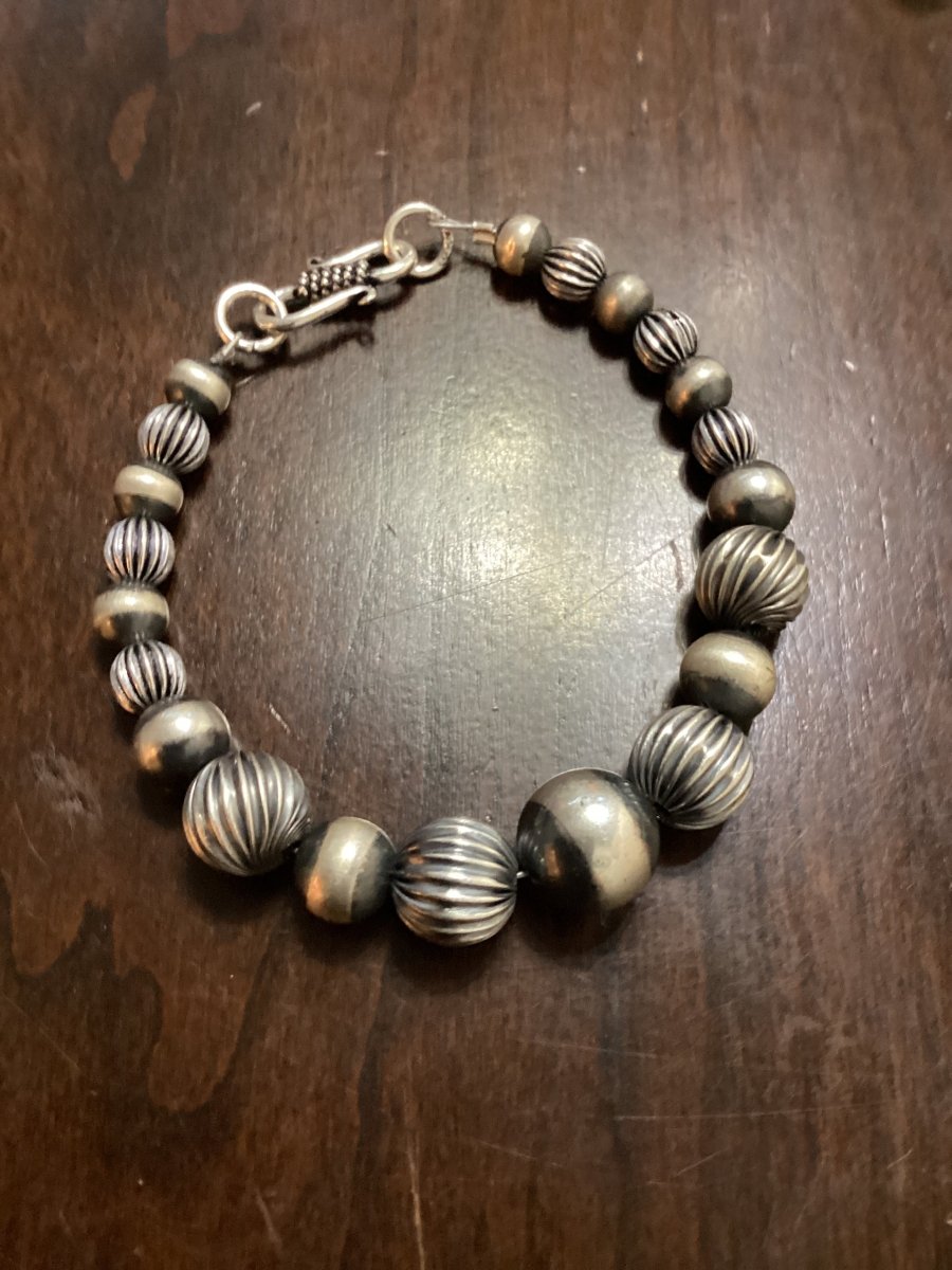 Bracelet, graduated, some corrugated, 4mm to 12 mm mixed Navajo Pearls, Turquoise Mustang - Turquoise Mustang