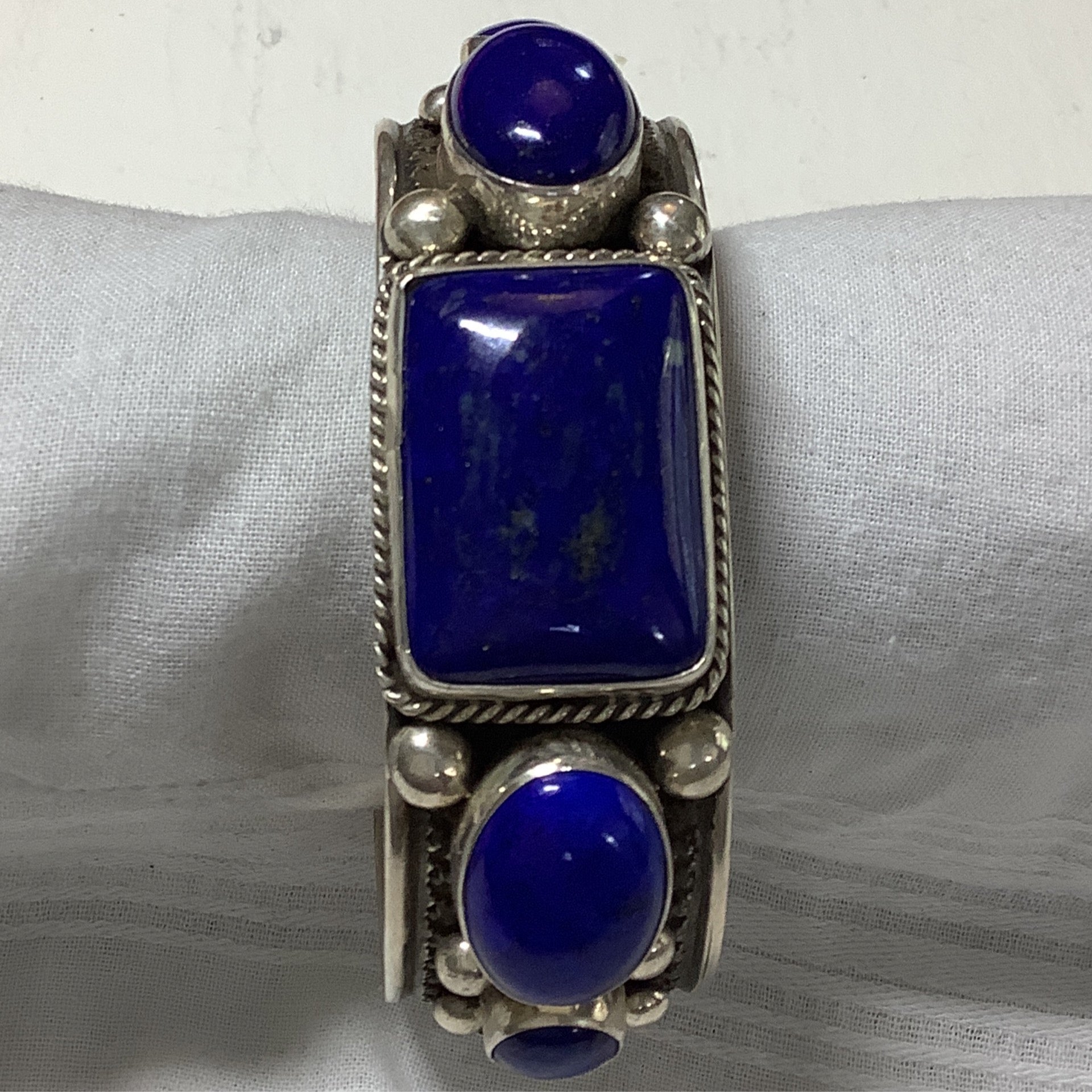 Bracelet, 5-Stone Lapis w Rect. Center, 3-Row Stamp, Guy Hoskie crafted from Sterling Silver, an exquisite Bracelets Native America designed by Turquoise Mustang.