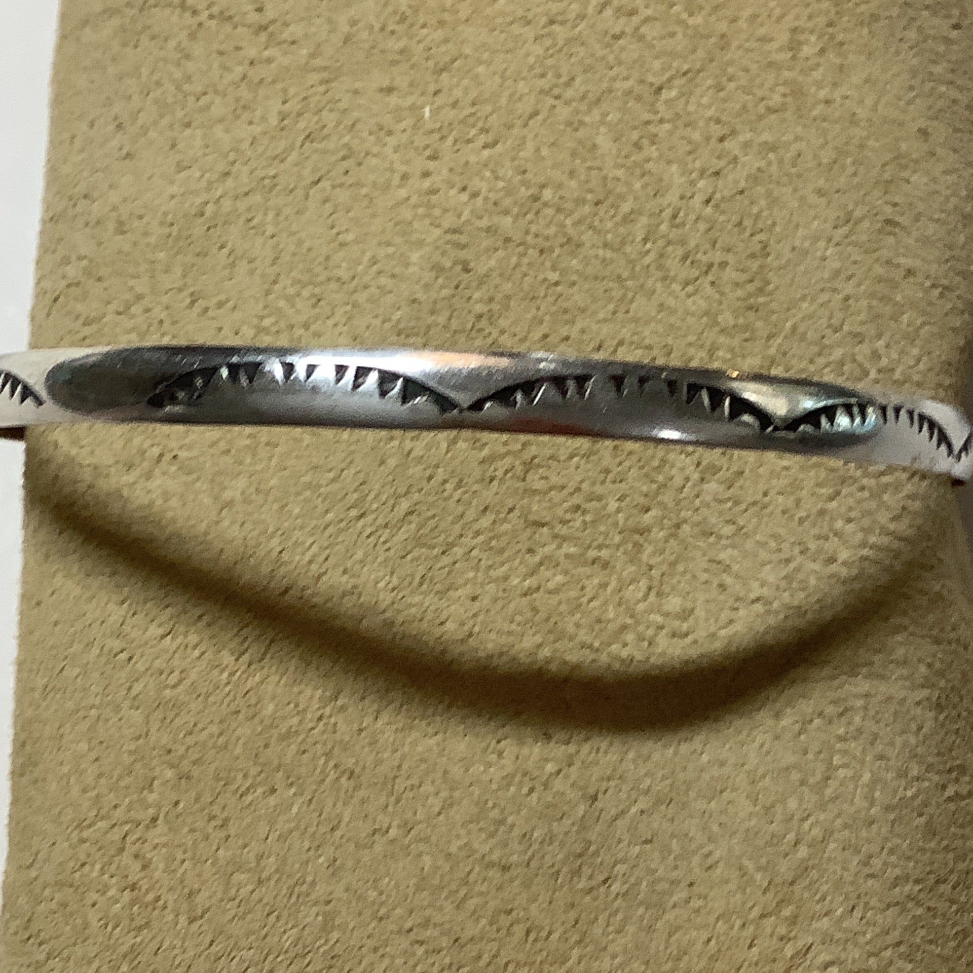Bangle, size small, stamped, half round wire, mountain scape, Elaine Tahe crafted from Sterling Silver, an exquisite Bangles, Native American designed by Turquoise Mustang.