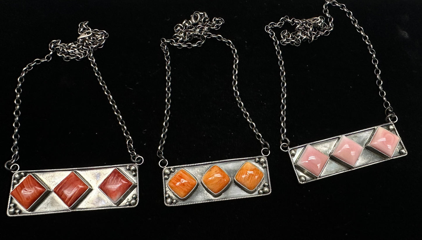 Trudy 3-Stone Bar Necklace crafted from Pink Conch, an exquisite Necklaces designed by Rays.