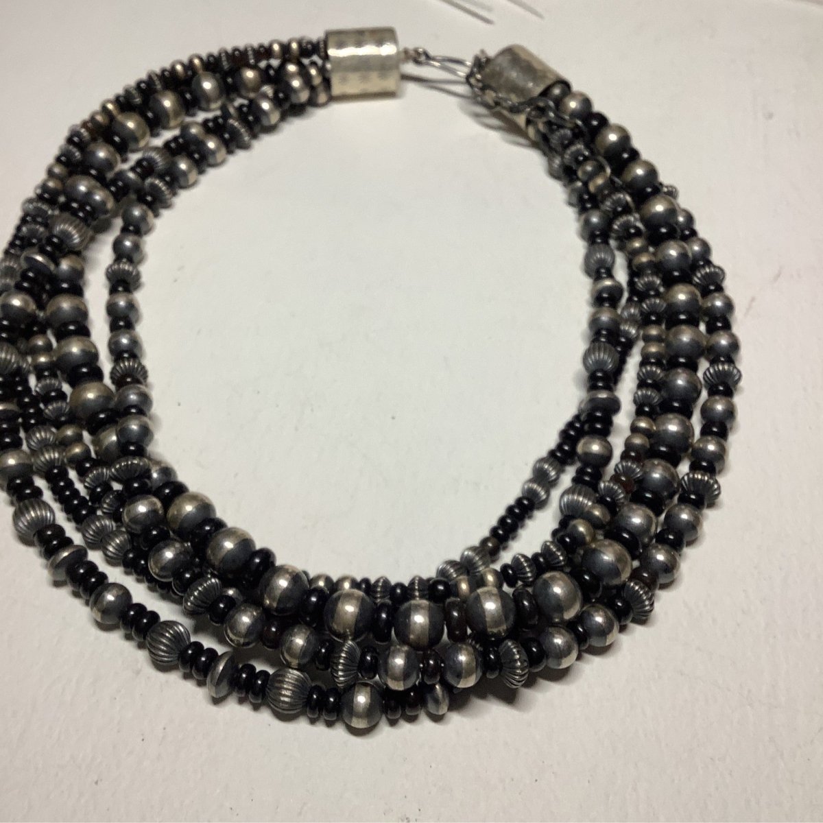 20", 5 - Strand, 7 - 10mm Navajo Pearls & Corrugated Saucers with Onyx, Dan Dodson - Turquoise Mustang