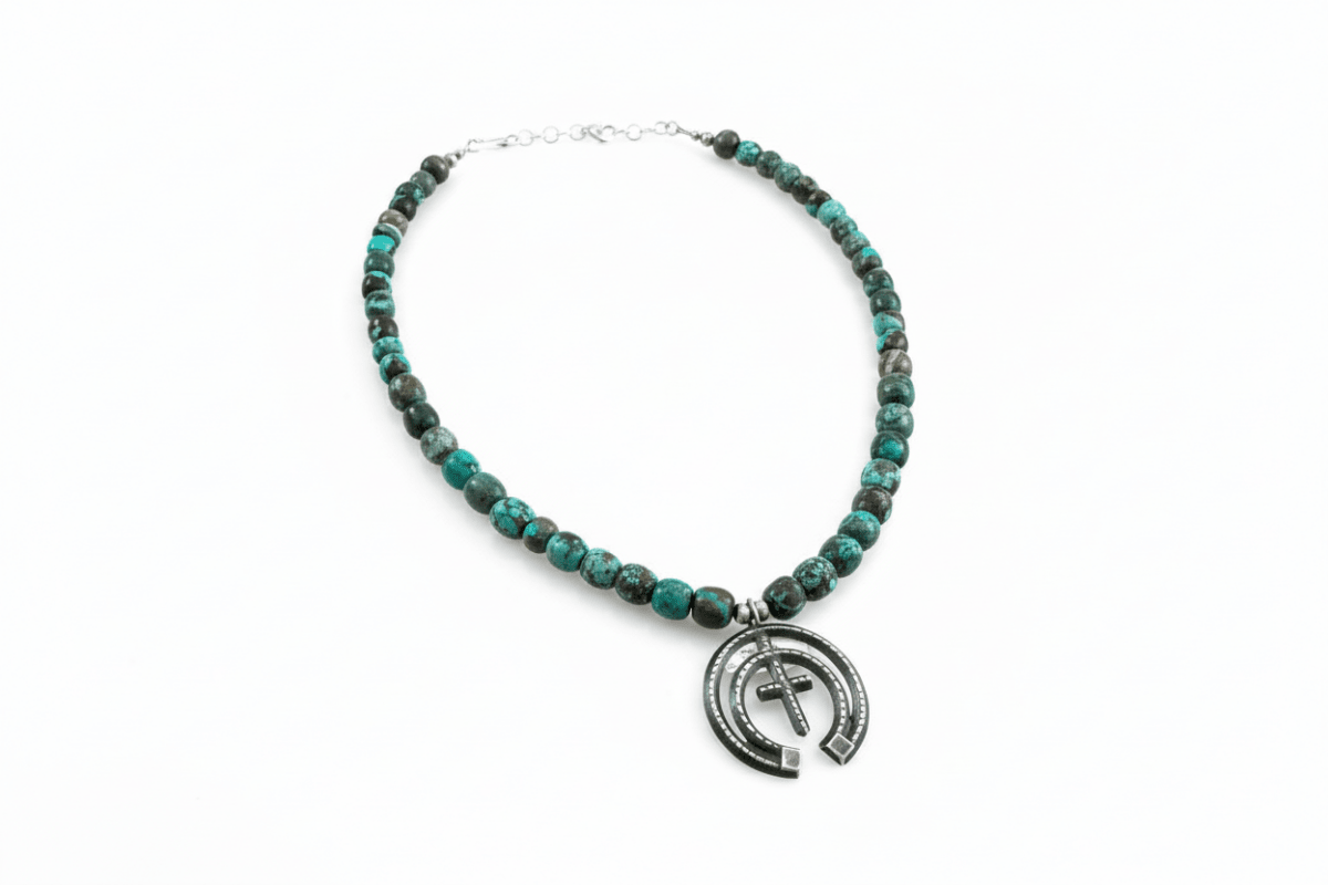 18” Cloud Mountain Barrel Bead Necklace with Oxidized Naja Pendant - Turquoise Mustang