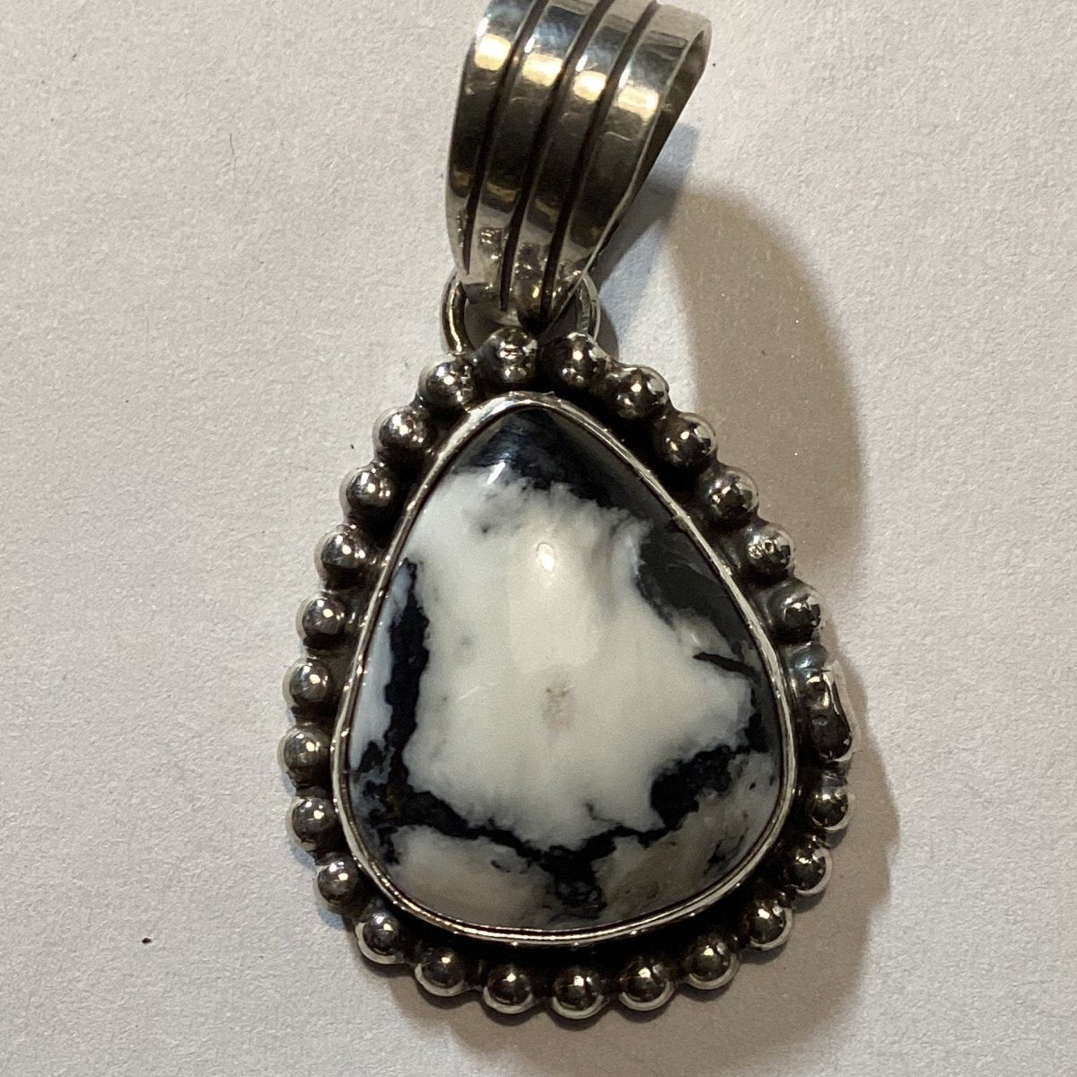 Pendant, small teardrop White Buffalo, raindrop bead bezel, L. Yazzie - Turquoise Mustang