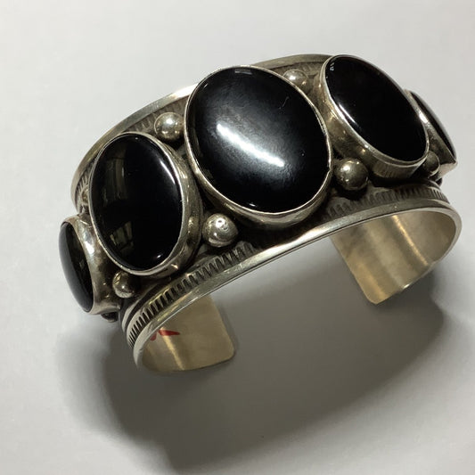 Bracelet, 5 oval Onyx stones, 9 rows of stamp work, raindrops, four peyote buttons on side, by Albert Jake - Turquoise Mustang