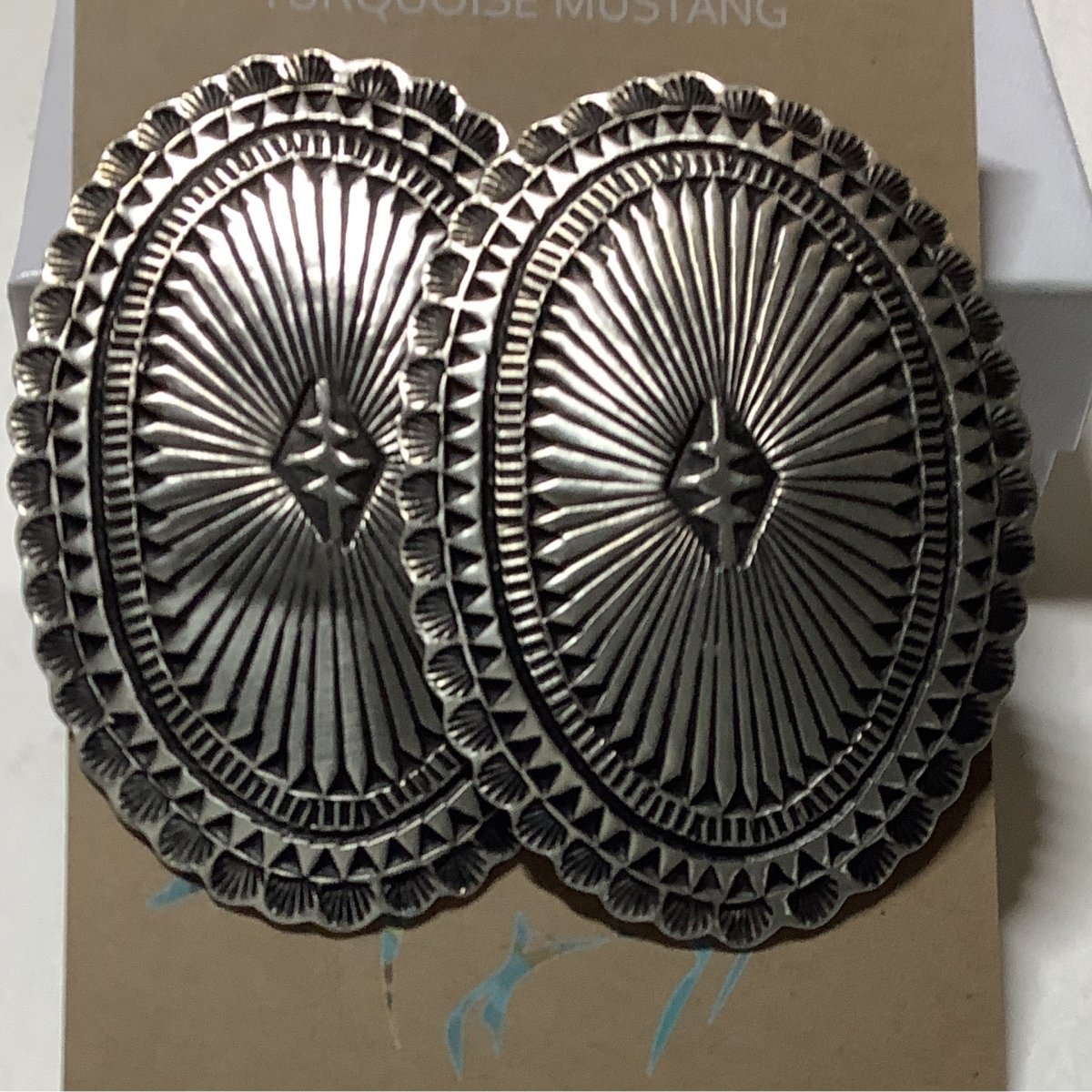 Earring. Single Oval Concho, Stamped, Leander Tahe (1) - Turquoise Mustang