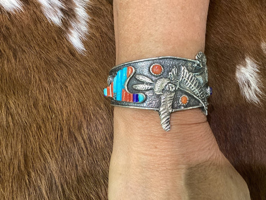Stunning Tufa Cast with Hummingbird Kachina motif and Cobblestone inlay featuring turquoise,coral, and lapis by Lester James - Turquoise Mustang
