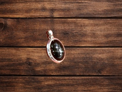 Pendant, oval, black star sapphire , 1.75” long, beveled bezel, TM - Turquoise Mustang