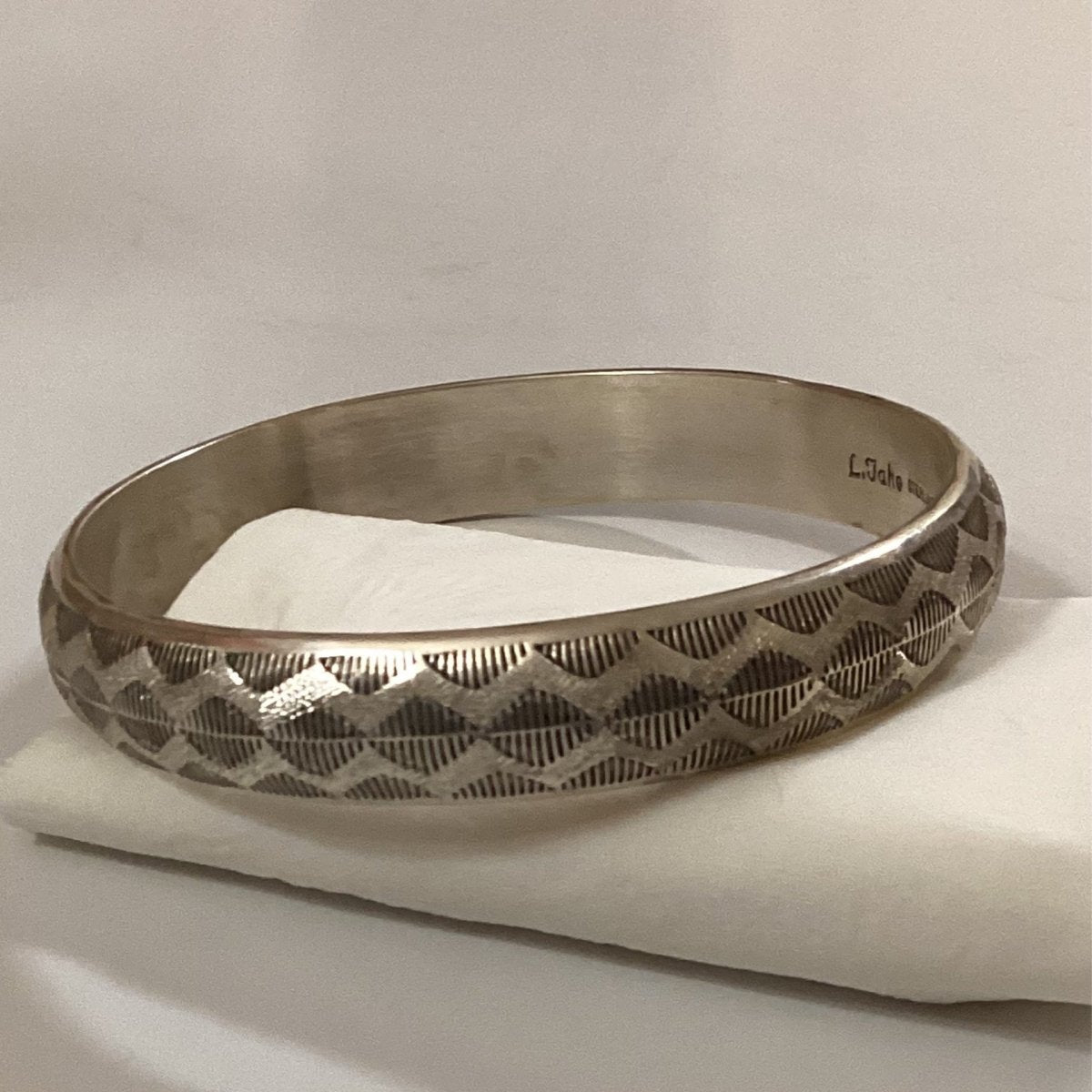 Bangle, convex stamped dazzler pattern, Leander Tahe - Turquoise Mustang