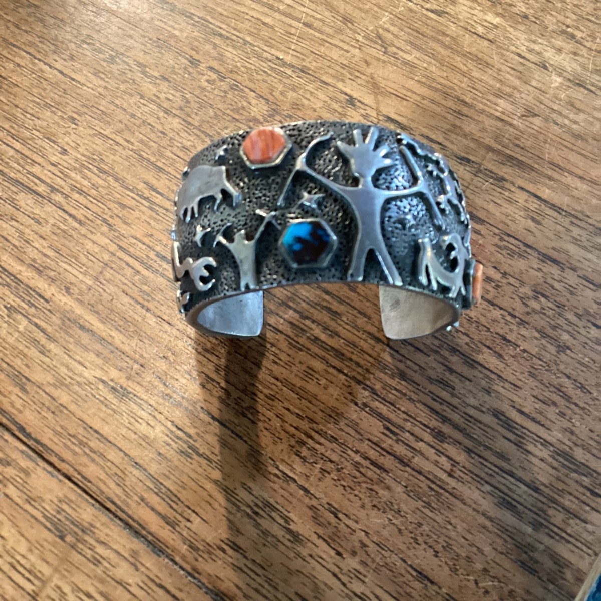 Bracelet, Sand Cast with silver petroglyphs and pentagon stones, by Danny Romero - Turquoise Mustang