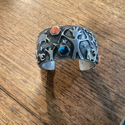 Bracelet, Sand Cast with silver petroglyphs and pentagon stones, by Danny Romero - Turquoise Mustang