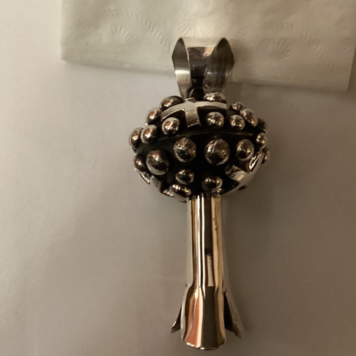 Pendant, globe style single squash blossom with raindrops and crosses, Chimney Butte - Turquoise Mustang