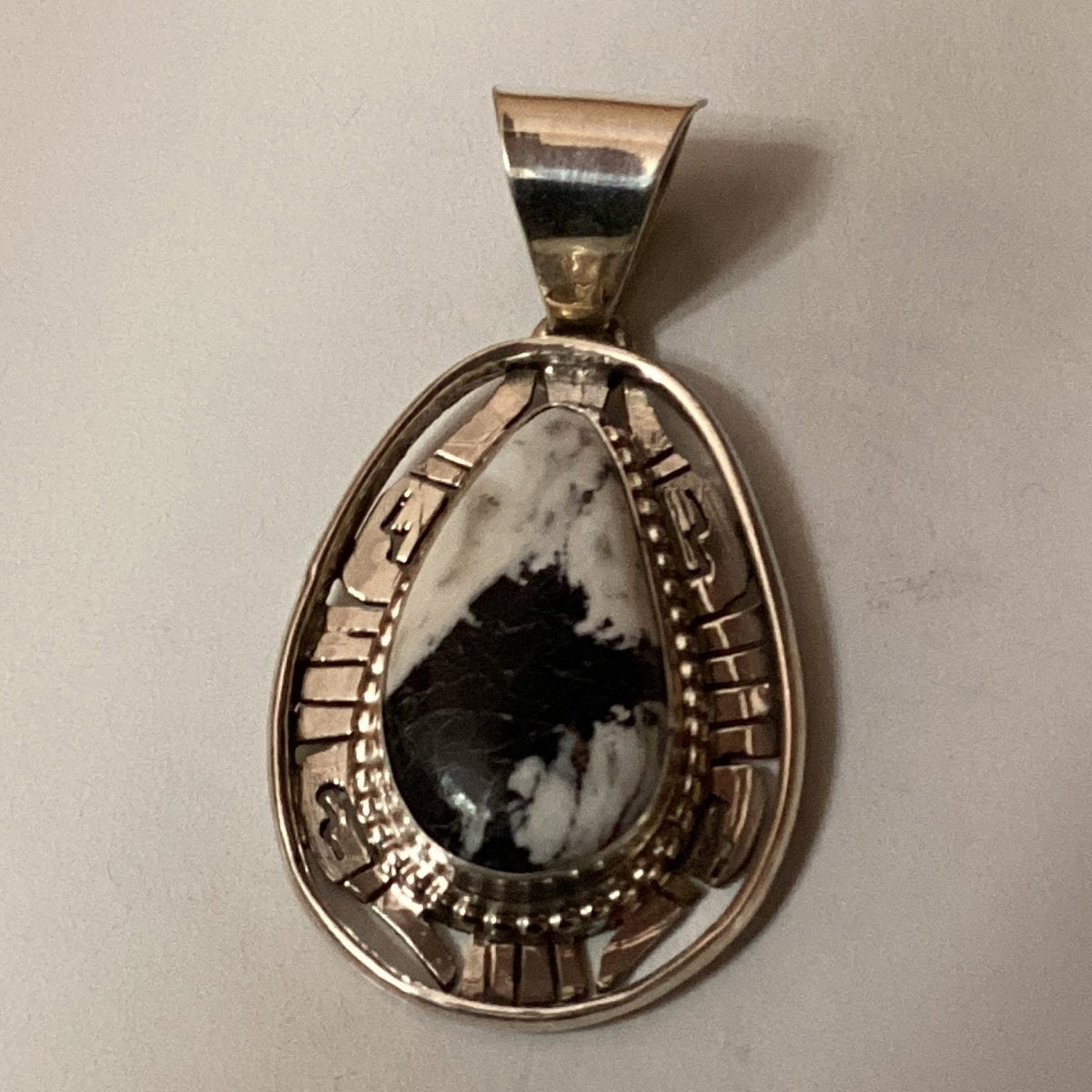 Pendant, White Buffalo teardrop, cutout file work bezel, Reggie Hoskie - Turquoise Mustang
