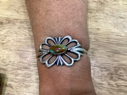 Tufa Cast Cuff With Oval Royston Turquoise center by Emma & Wilson Carviso, Jr - Turquoise Mustang