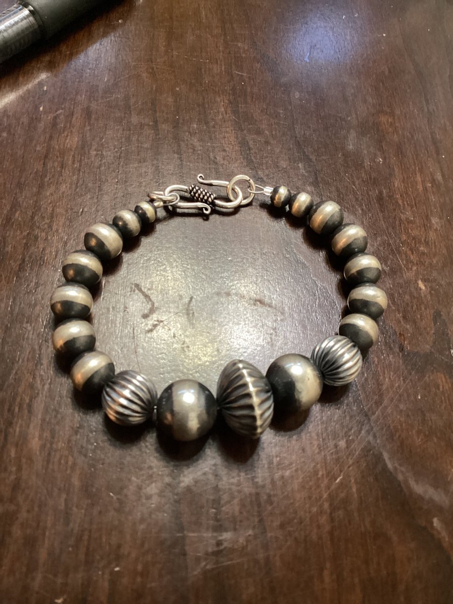 Bracelet, graduated, some corrugated, 5mm to 14mm mixed Navajo Pearls, Turquoise Mustang - Turquoise Mustang