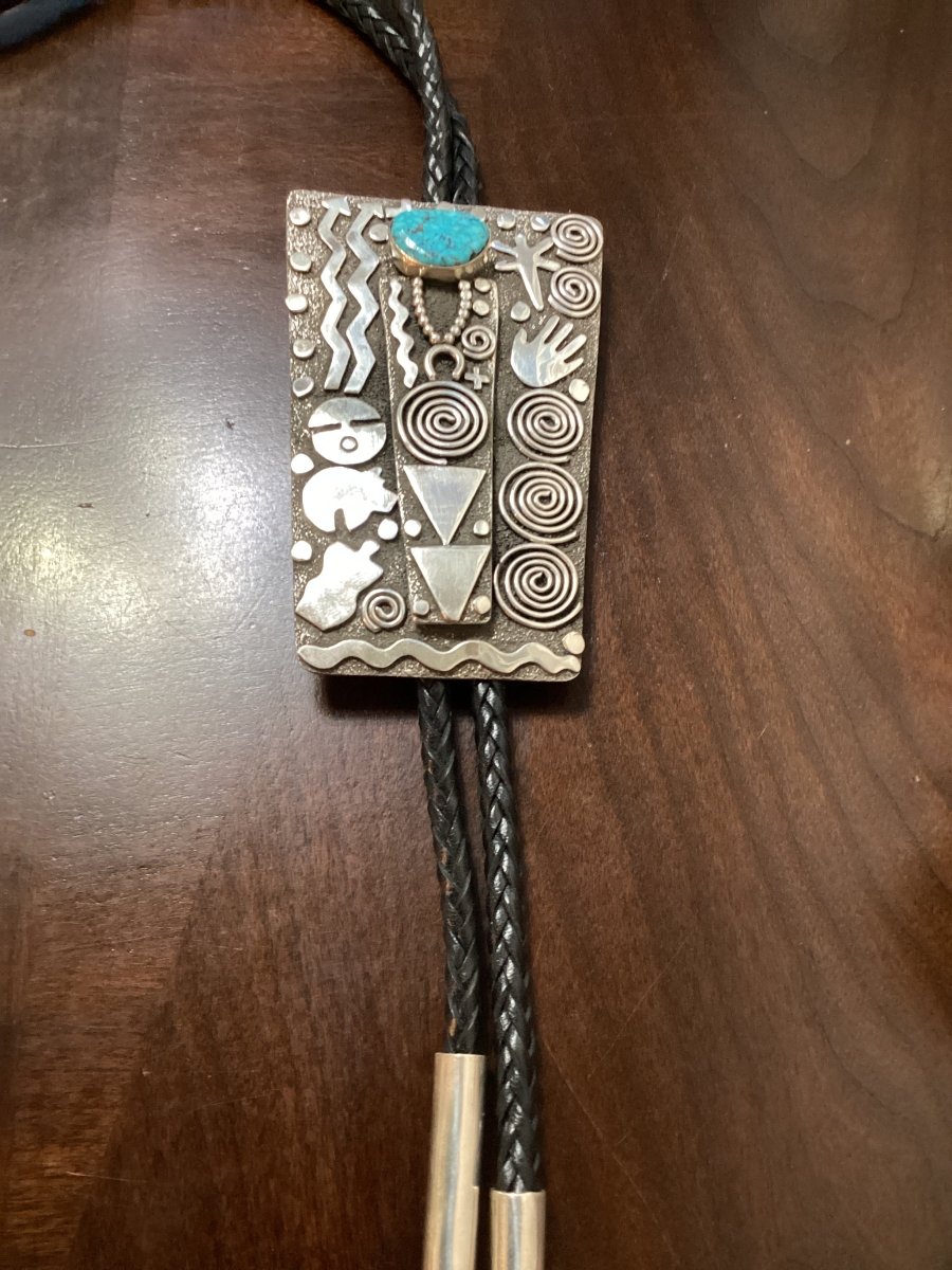 Bolo, Hi - grade Kingman Waterweb cab, Petroglyph design, Alex Sanchez hallmark - Turquoise Mustang