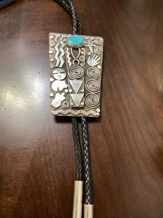 Bolo, Hi - grade Kingman Waterweb cab, Petroglyph design, Alex Sanchez hallmark - Turquoise Mustang