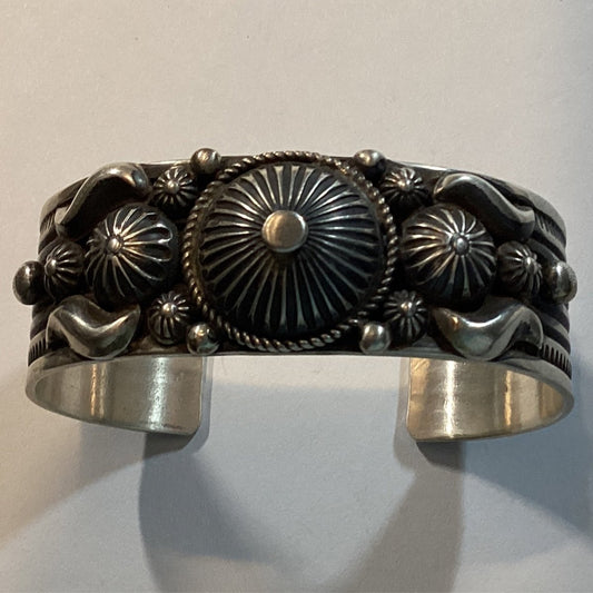 Bracelet, all silver, medium width peyote button, daisy Concho, A. Jake HBH - Turquoise Mustang