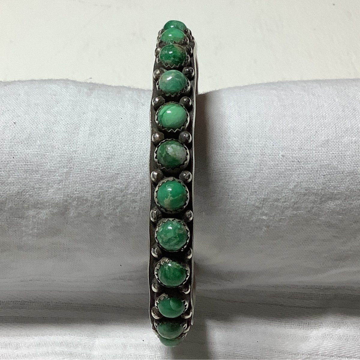 Bracelet, 14 - Stone Round Broken Arrow, Stampwork insided & out, NB (Nelson Burbank?) - Turquoise Mustang