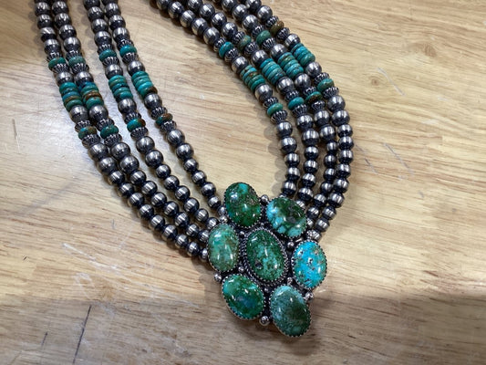 Necklace, 4 strands 6 - 8mm Navajo pearls, Sonoran Gold 7 oval center, Turquoise rondelles, Sally Nez - Turquoise Mustang