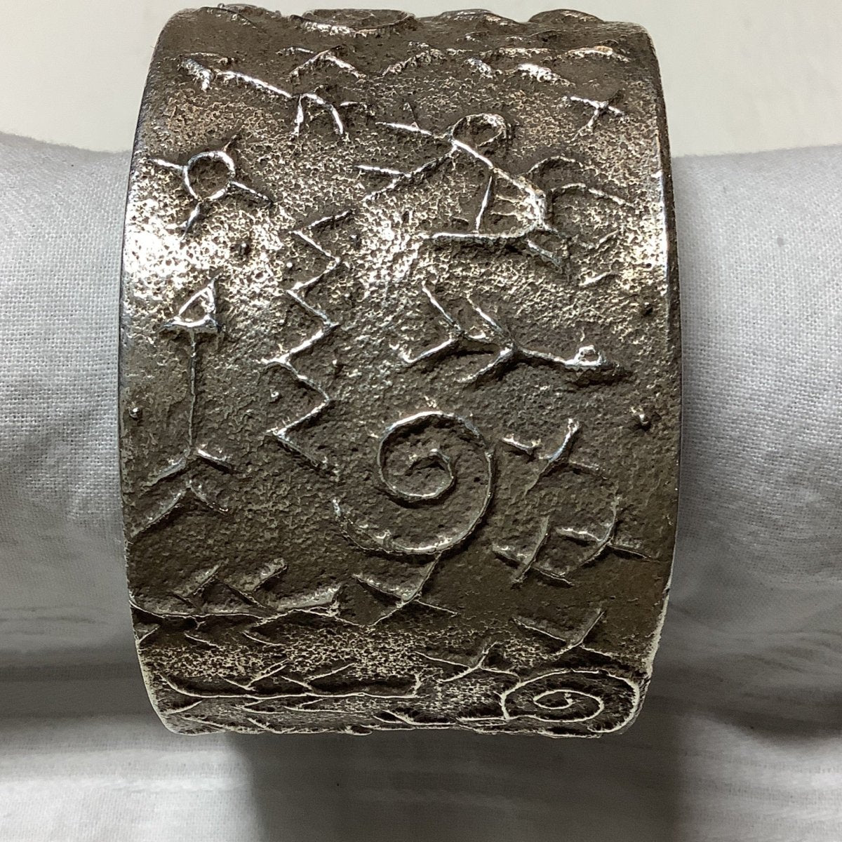 Bracelet, all silver petroglyphs, Tufa cast, Stewart Billie - Turquoise Mustang