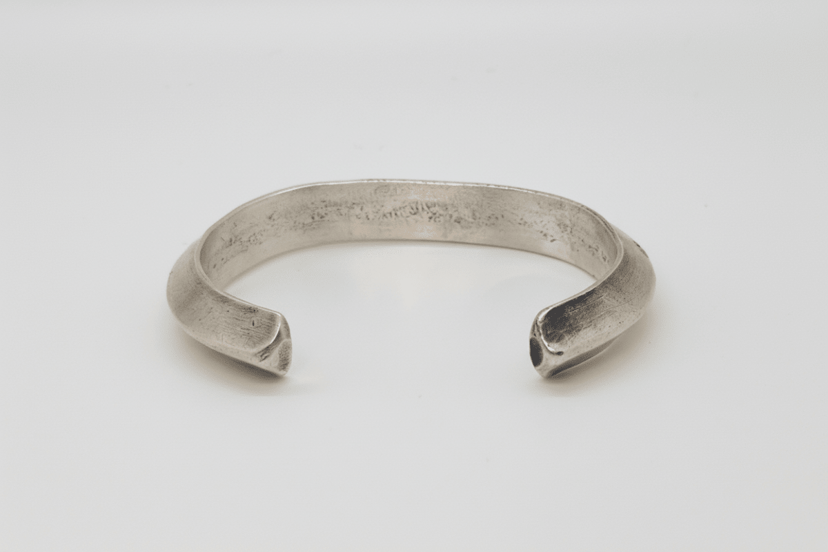 Bracelet, Early (circa 1970) heavy triangle wire, stamped cuff attributed to Tahe family - Turquoise Mustang