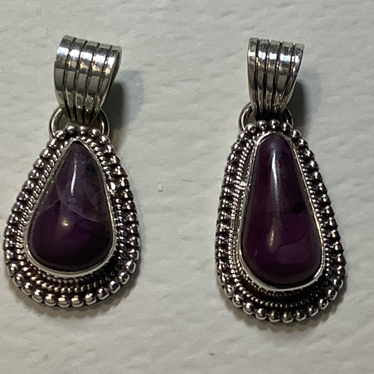 Pendant, Sugilite, Pear Cab with Raindrop bezel, DD - Turquoise Mustang