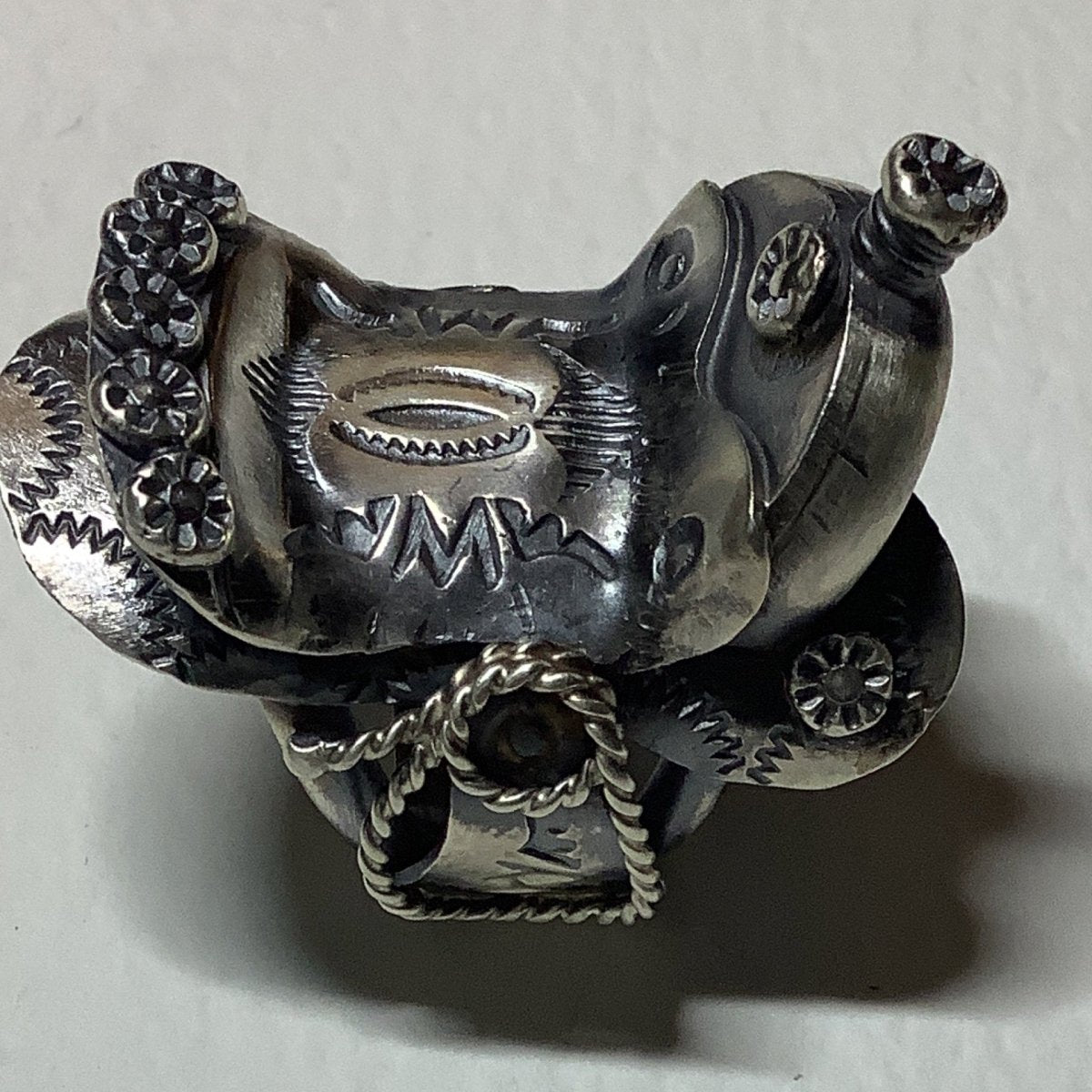 Ring, All silver, Repousse and stamp SADDLE, Tim Yazzie - Turquoise Mustang