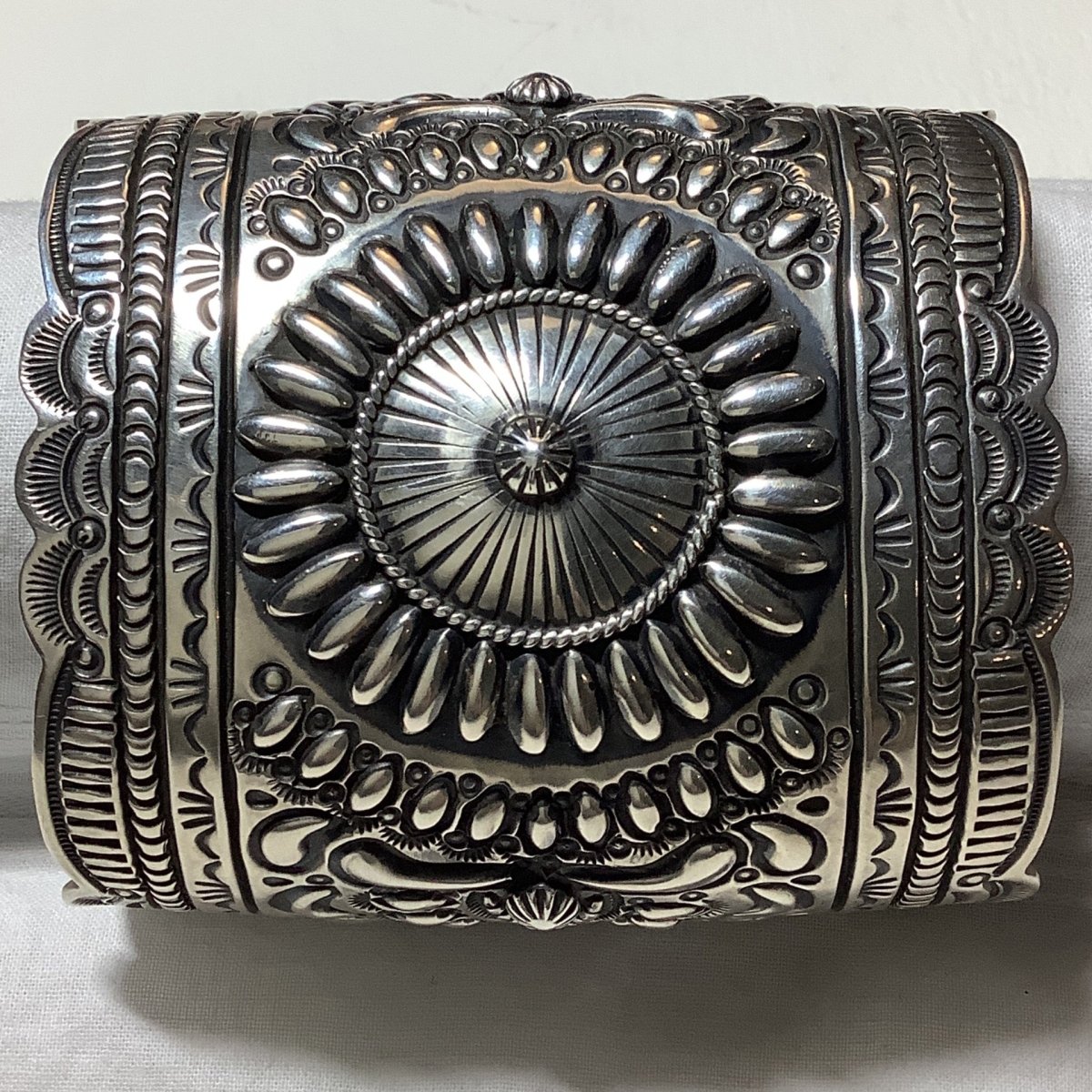 Bracelet, all silver, Bow Cuff, 9 Row Stampwork, Repoussee, Daryll Becenti - Turquoise Mustang